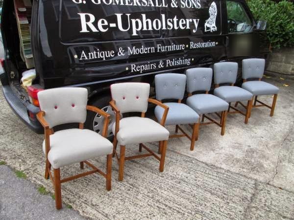 Six re-upholstered dining armchairs lined up beside the G. Gomersall and Sons van