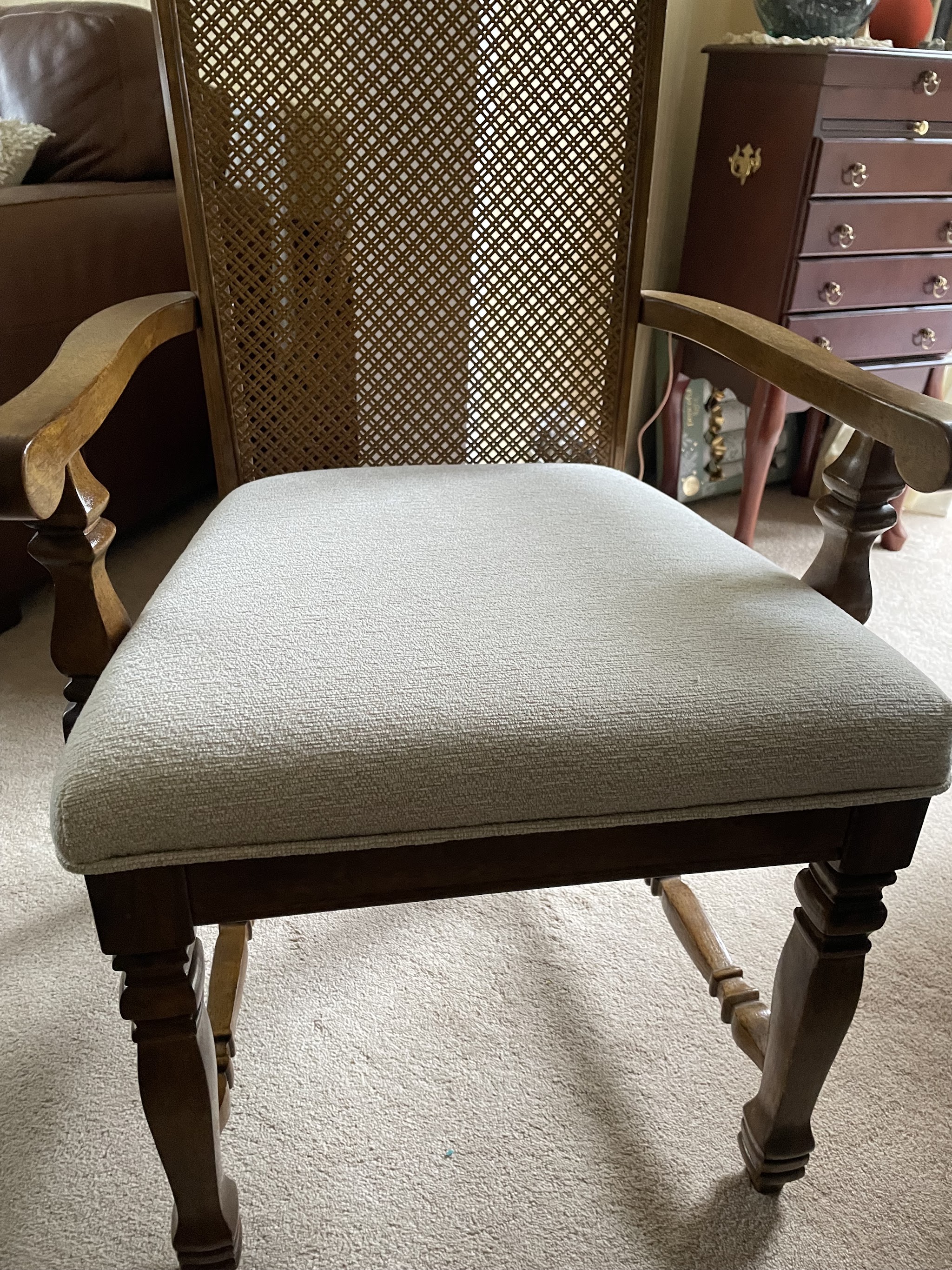 A re-upholstered dining chair seat in a customer's home