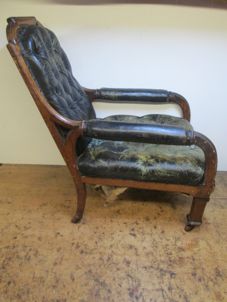 An Oxford Union Poetry Room chair before, its leather worn through