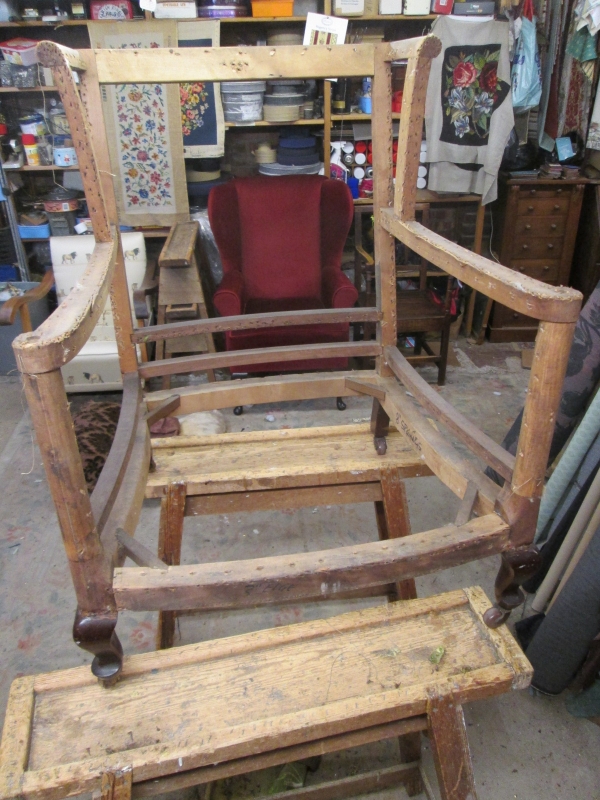 An armchair taken back to its frame