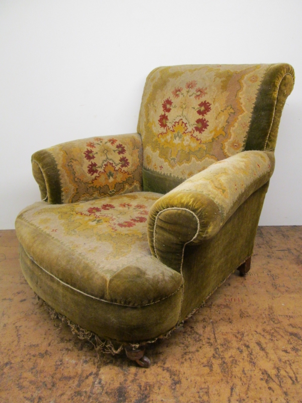 A tired Victorian armchair before restoration