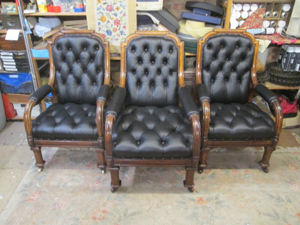 Three Oxford Union Poetry Room armchairs restored in black buttoned leather