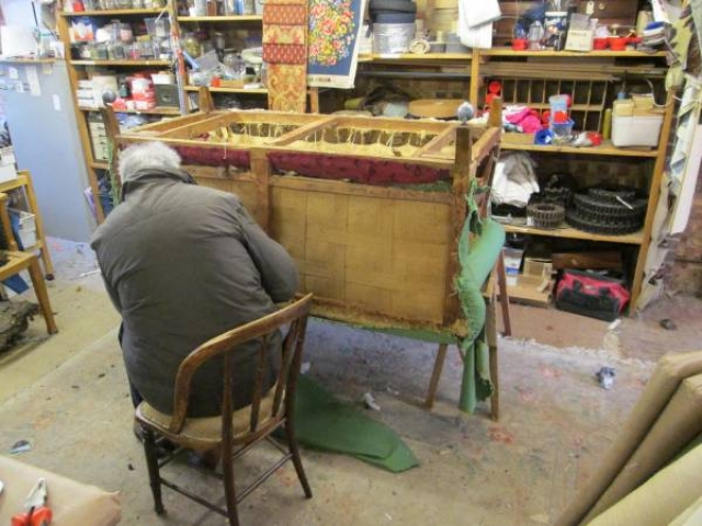 Working on a sofa frame in the workshop
