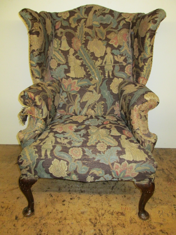 A 19th century wing chair in tapestry fabric