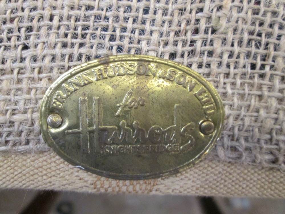 The maker's brass plaque reading Frank Hudson and Son, for Harrods, Knightsbridge